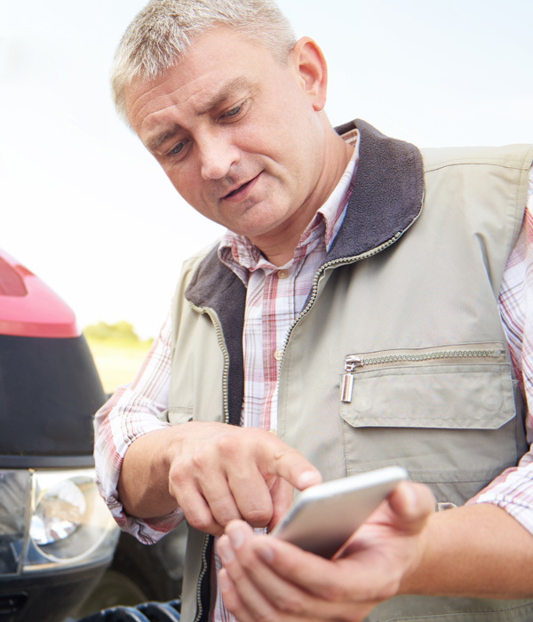 Image of a man looking at his phone